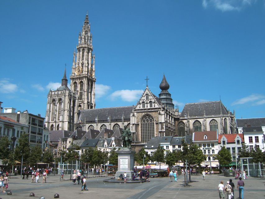 Antwerp: Private Historical Highlights Walking Tour - Hendrik Conscience Statue, the old library, and the Baroque church mood shift