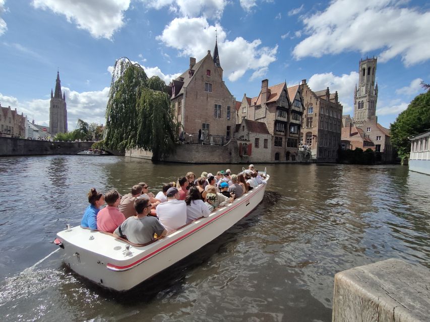 Bruges: Small Group Boat Cruise and Guided Walking Tour - Basilica of the Holy Blood, courthouse statues, and the narrowest street