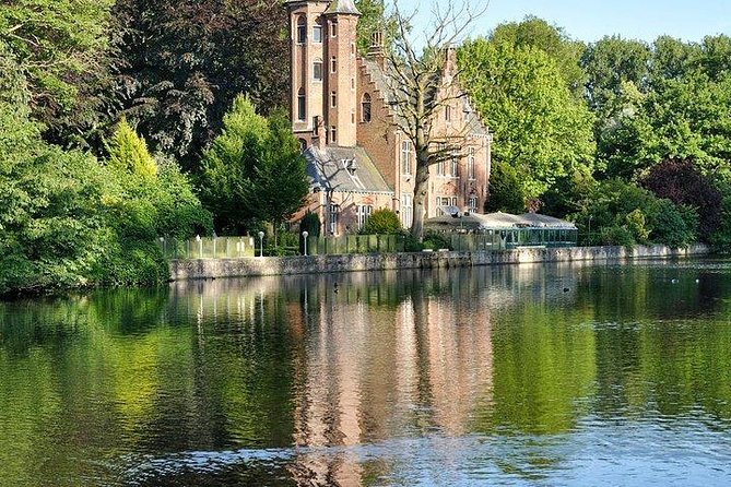 Bruges Uncovered: Historic Walking Tour & Canal Boat Experience - Holy Blood Basilica and Onze-Lieve-Vrouwekerk: two landmark stops