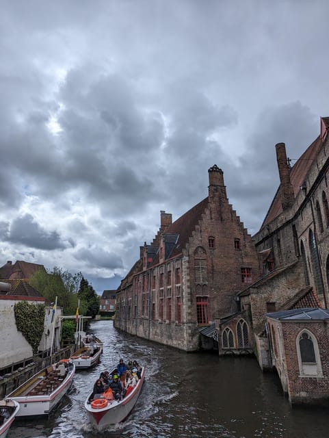 Bruges: Walking Tour with Hot Chocolate & Chocolate Tasting - Markt and Burg Square, where stories meet the Belfry area