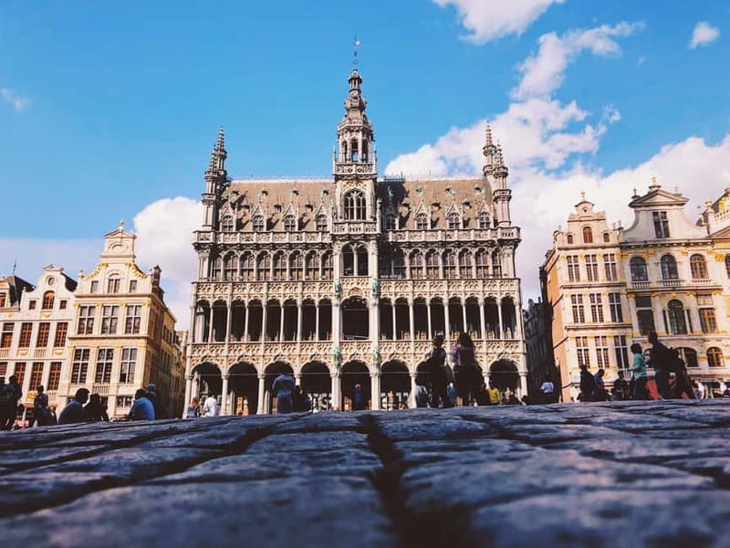 Brussels Highlights: Walking & Bus Tour with Waffle Tasting - Grand Place and Manneken Pis: The Photo Stops That Actually Teach You What to Look For