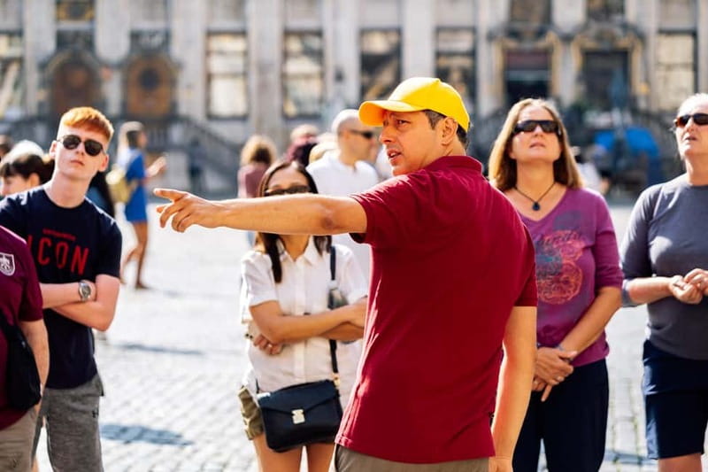 Brussels: Historical Tour with Chocolate & Waffle Tasting - Where you meet: the Grand Place, city hall steps, red and green umbrella