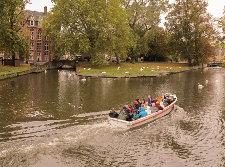 From Paris: Bruges Guided Tour with Hotel Pickup - The traditional village walk and the visitor center pause