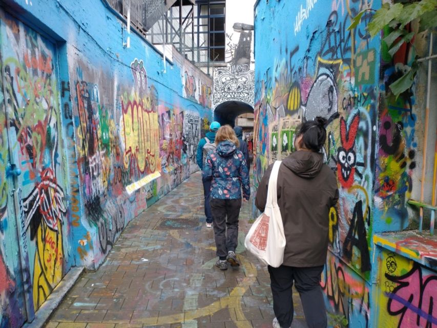 Ghent: Guided City Highlights Walking Tour with Light Meal - Graffiti Street: street art, a pencil-friendly moment, and a good breather