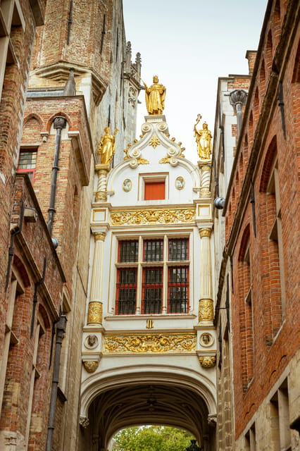 Historical walk in Bruges with local guide. Praline included - Dijver canal to Tanners Square, plus the red-light district (handled respectfully)