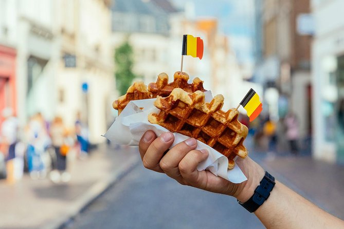 The 10 Tastings of Bruges With Locals: Private Food Tour - Gruuthusemuseum stop and the classics: waffles, fries, and the local flavor test